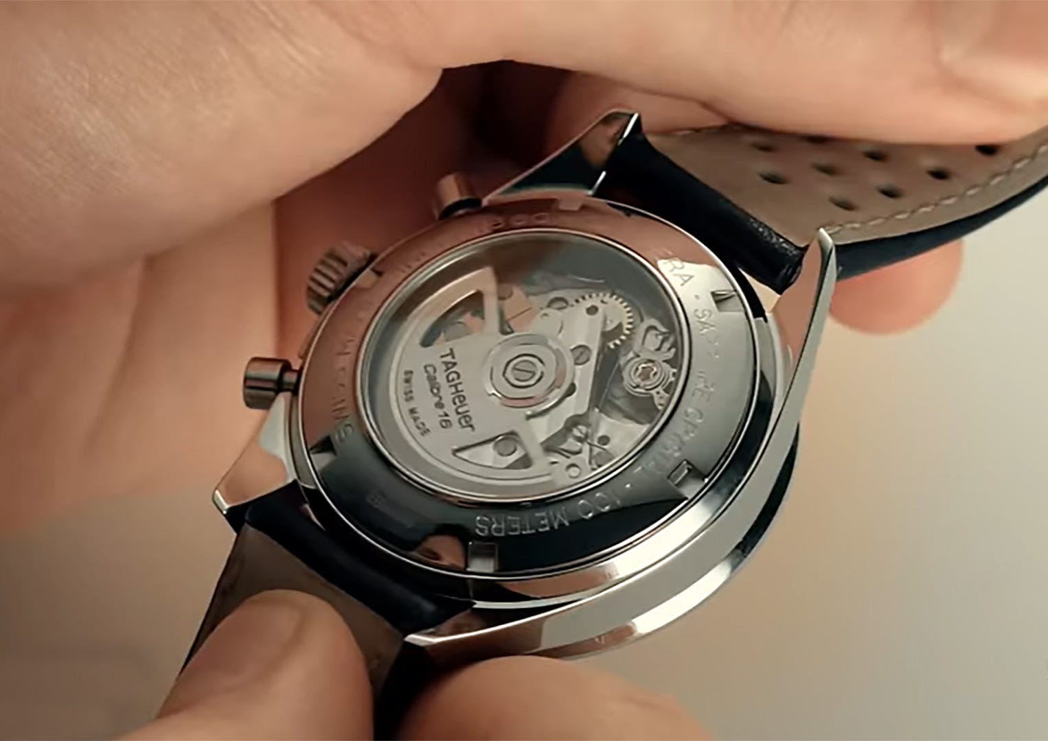 The winding rotor of a TAG Heuer watch seen through the exhibition case back